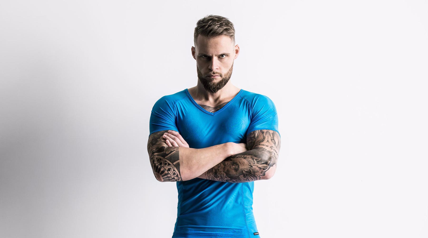 Male model wearing MANSTORE T-shirt for men available at MensUnderwear.io
