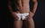 Male underwear model wearing lace underwear for men available at MensUnderwear.io
